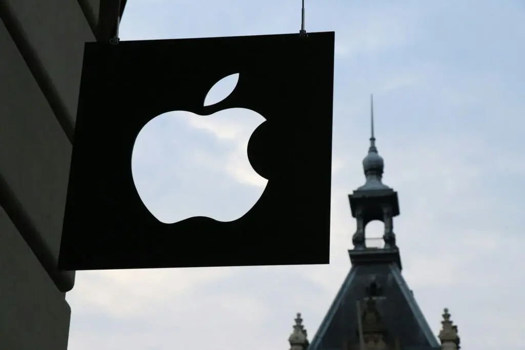 apple logo in front of a building