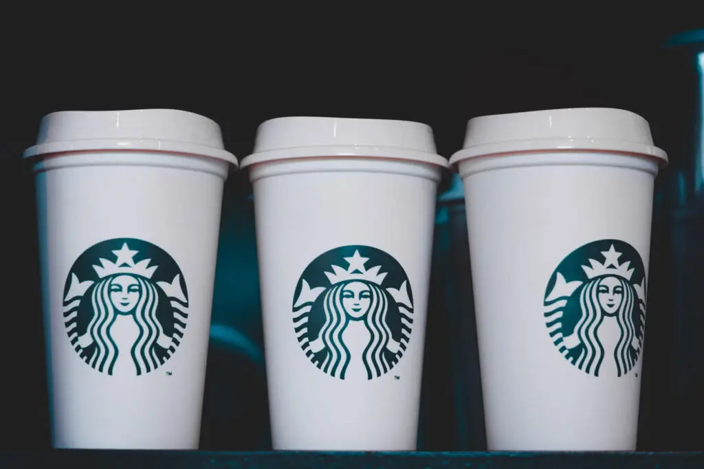 three starbucks cups aligned next to each other