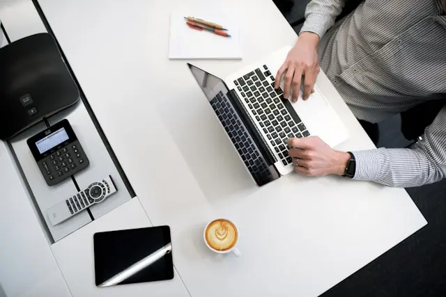 a person typing on a laptop