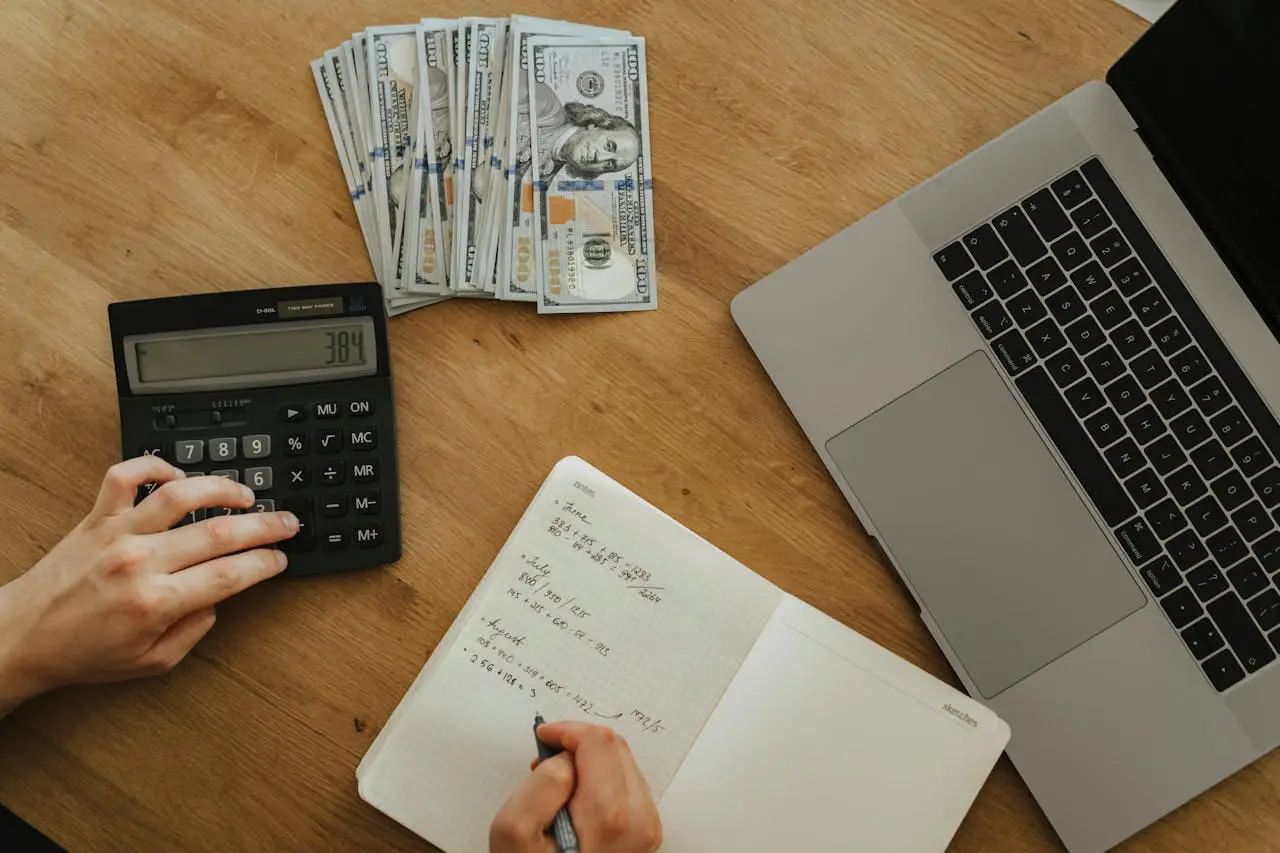 a person doing calculations at a desk