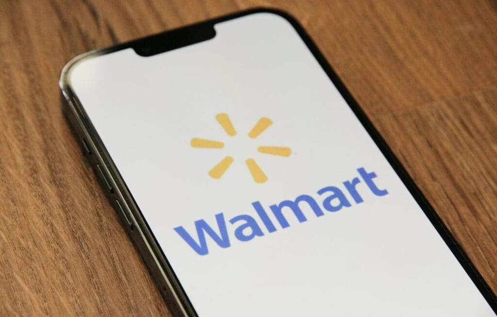 A phone showing the Walmart title and logo