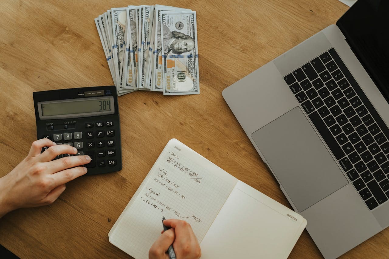 a person doing calculations at a desk